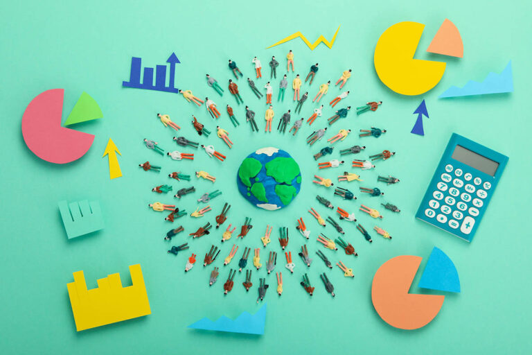 Miniature figures surrounding a globe with financial charts and a calculator, symbolising ESG impact investing and sustainable financial strategies.