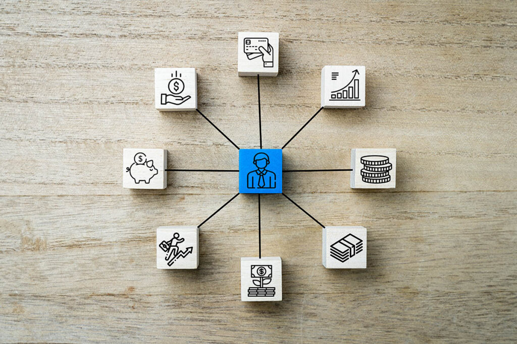 Stacks of gold coins connected by strategic arrows with chess pieces, representing multi-asset investment planning and wealth allocation strategies.